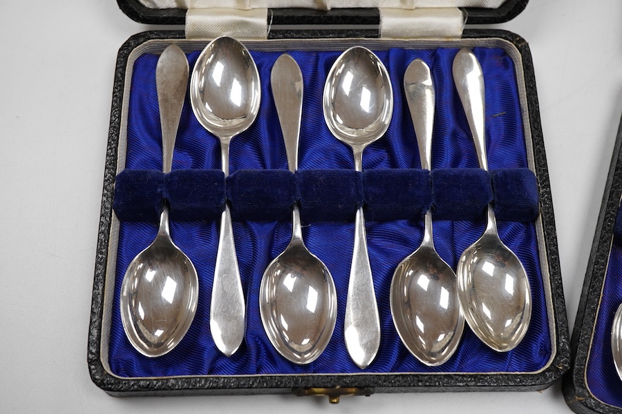 Two cased sets of six George VI silver teaspoons, Haseler & Restall, Birmingham, 1947, together with three assorted 19th century silver berry spoons.
